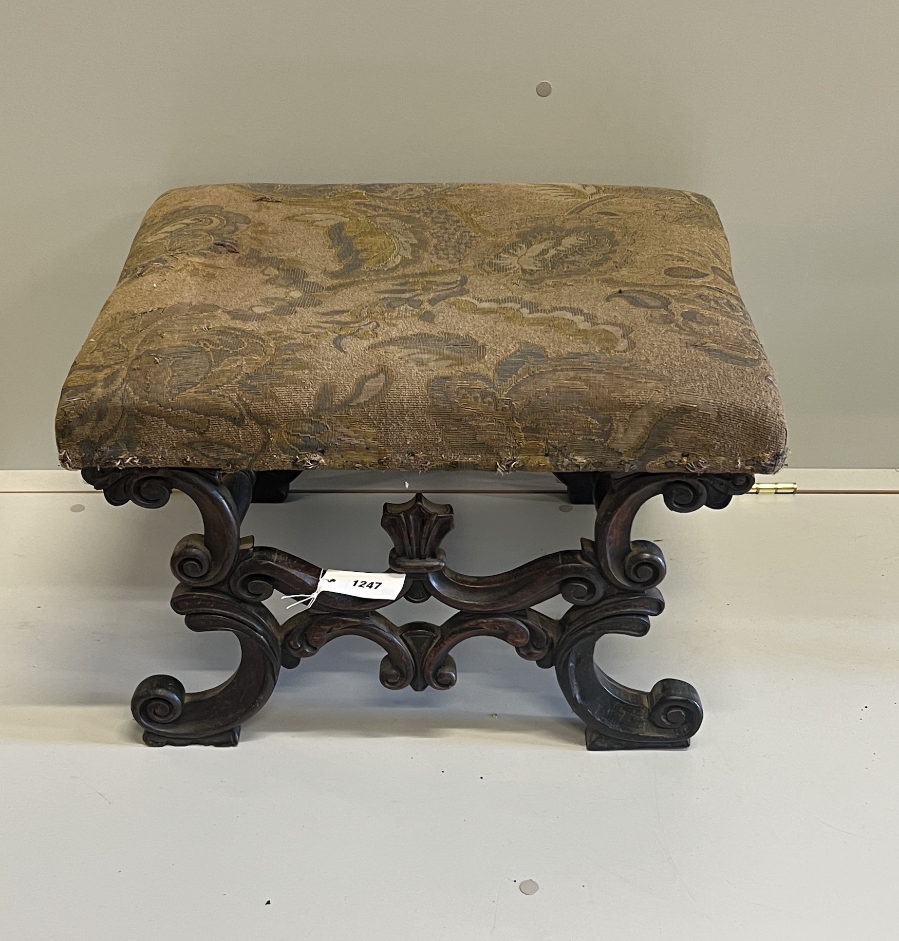 A Victorian carved and upholstered rectangular 'X' framed oak dressing stool, width 56cm, depth 45cm, height 36cm